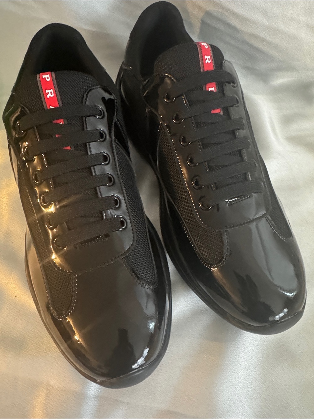 Prada America's Cup sneakers in black patent leather and technical mesh fabric!